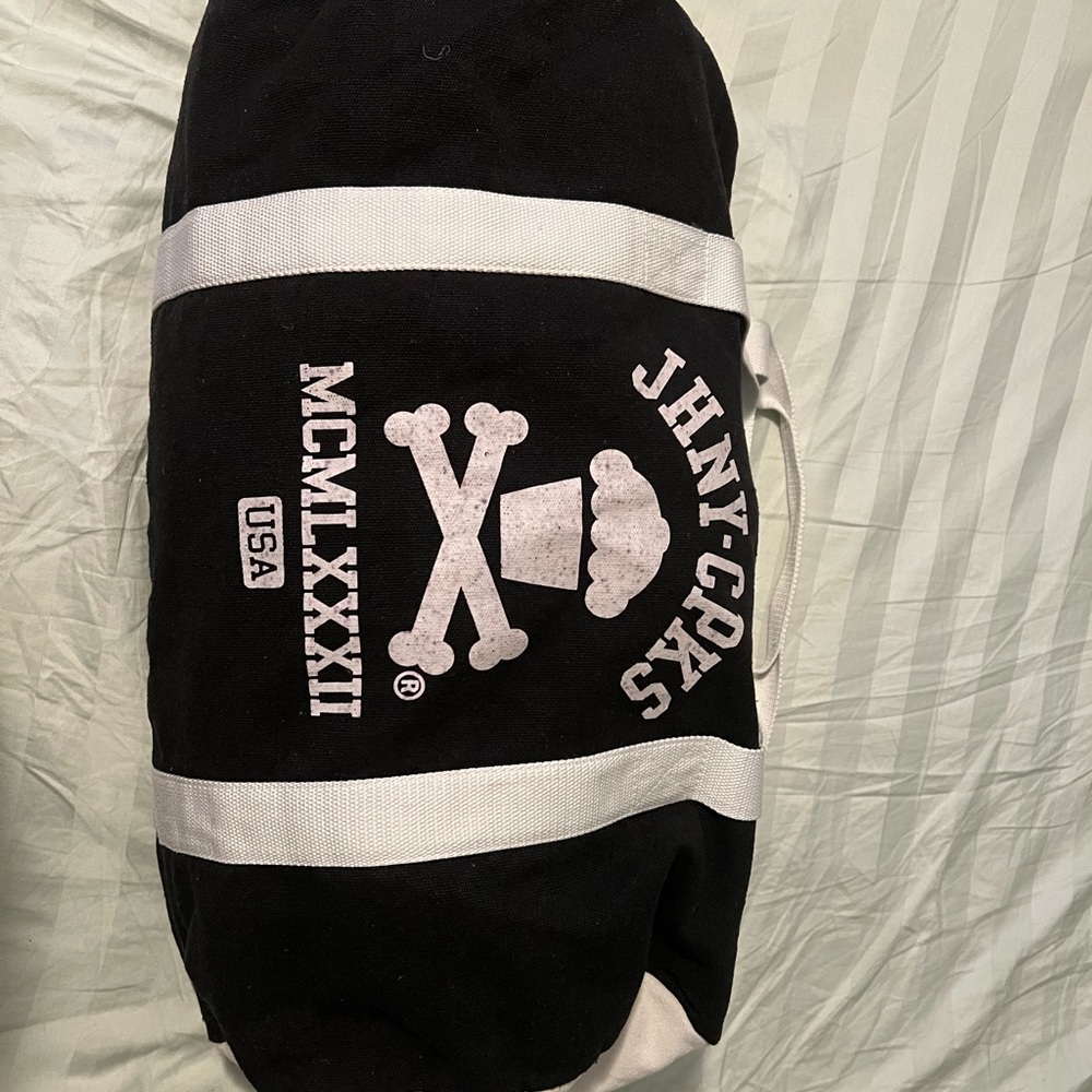 Johnny Cupcakes black and white duffle bag